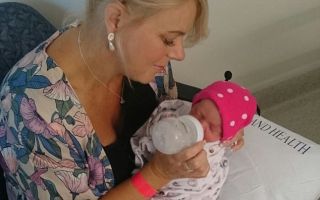 Woman, 43, who underwent 11 IVF treatments in five years delivers baby girl after flying to South Africa to obtain a donor egg